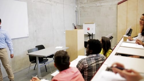 Students Attending Lecture in Modern Classroom Setting