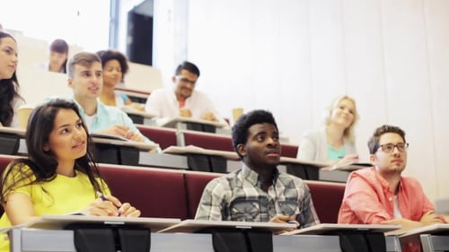 Students Attending Lecture in Bright Classroom