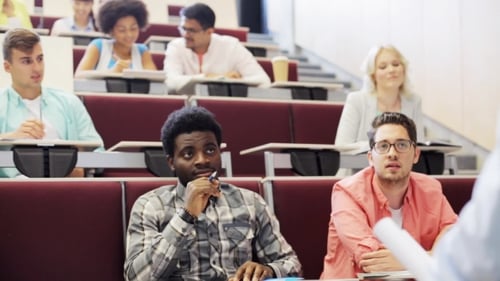 College Students Listening Attentively to Lecture in Hall