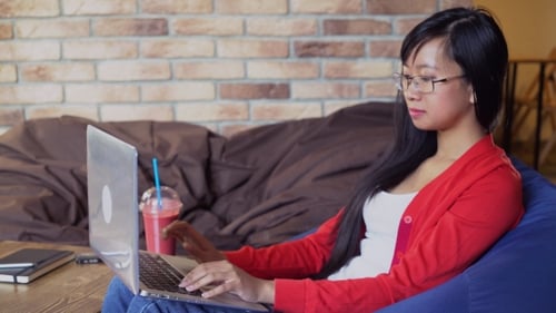 Woman Drinking Berry Fruit Smoothies In The Cafe.