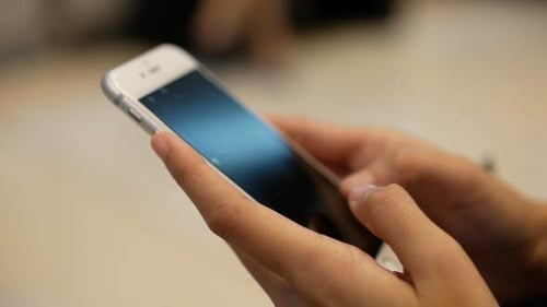 Close up of Hands Using a Smart Phone