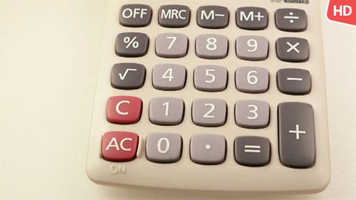 Calculator Device on White Background Zooms In
