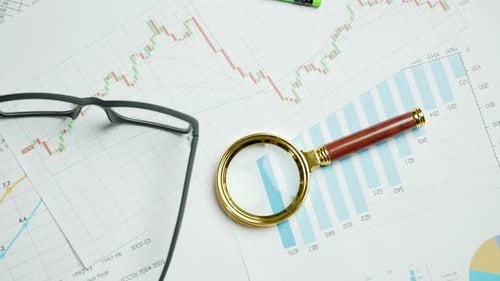 Documents with Magnifying Glass