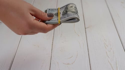 Money Exchange on a White Wood Background
