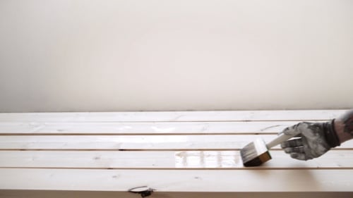 Hand Painting Wood Planks with Brush Indoors