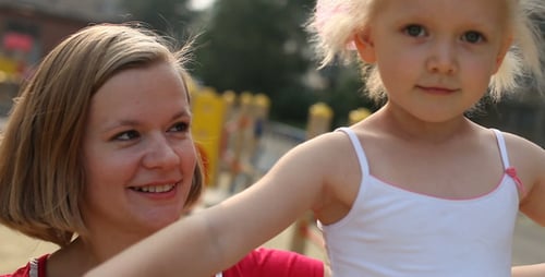 Mother and Daughter At Playground