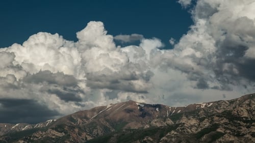 Of Clouds Moving Over Mountain