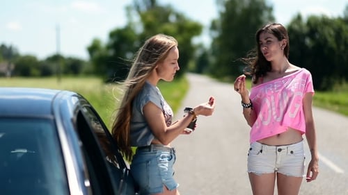 Young Adults Take a Break on Rural Road