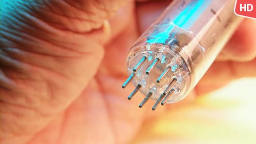 Close Up of Antique Electronic Tube Held in Hand