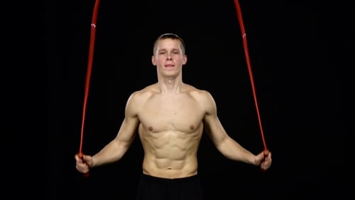 Man Demonstrates Jumping Rope. Black