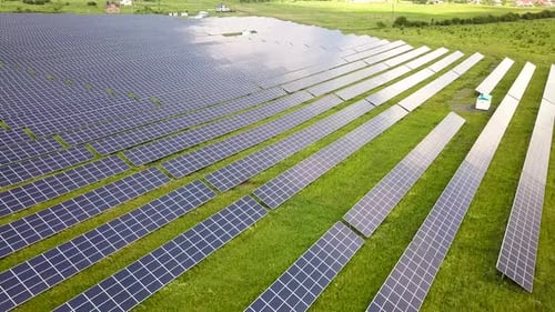 Aerial view of solar power plant field. Electrical photovoltaic panels for producing clean ecologic