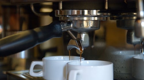Espresso Machine Pouring Coffee into Two Mugs
