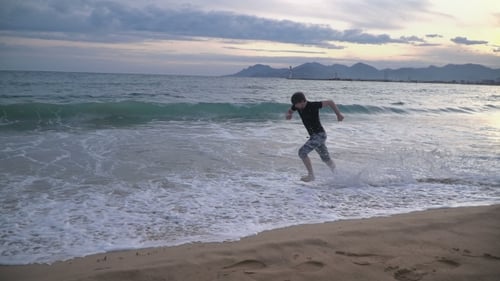 Man Running On The Beach