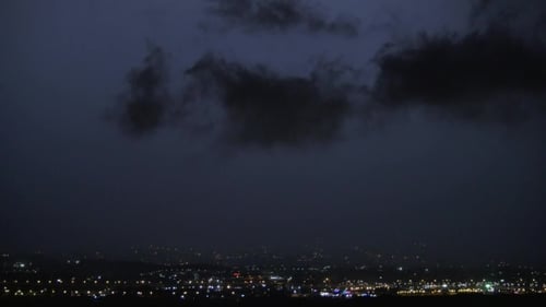 Sky And City Overshone With Lightnings At Night