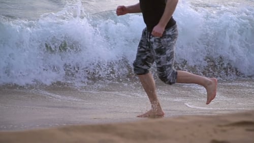 Man Running On The Beach
