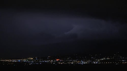 Thunderstorm In Night Illuminated City