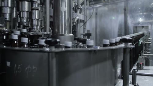 Automated Filling Machine Filling Small Bottles