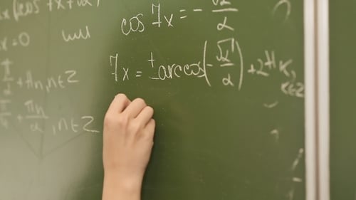 Hand Writing Math Equations on a Chalkboard