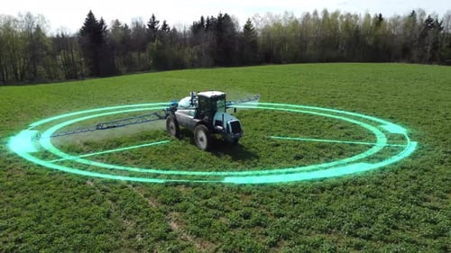 Tractor Spraying Pesticides With Graphic Overlay