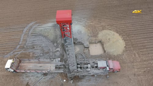 Aerial View of an Oil Drilling Rig in Field