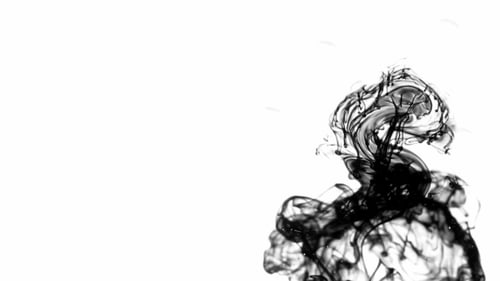 Black Ink Swirling Abstractly on White Background