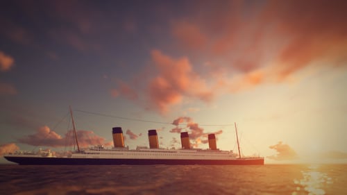 Majestic Passenger Ship Cruising Ocean into Golden Sunset