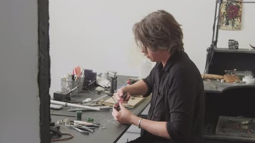 Female Jeweler Creating Wax Mold