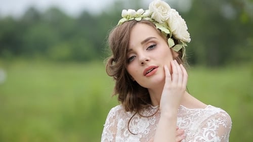 Beautiful Woman with Floral Crown Smiling in Nature