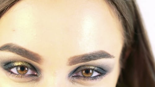 Woman's Face Close Up With Heavy Makeup