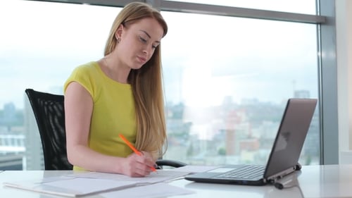 Girl Working With Laptop In Office
