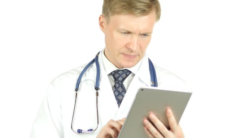 Doctor Using Tablet on White BAckground
