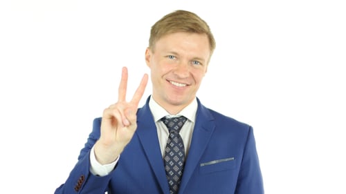 Man in Suit Gives Peace Sign
