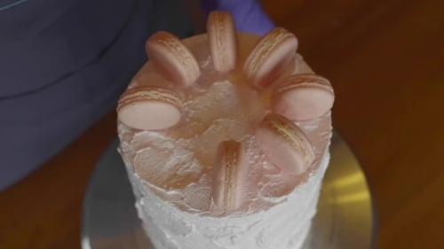 Decorating Cake with Macarons Top-Down Close-Up