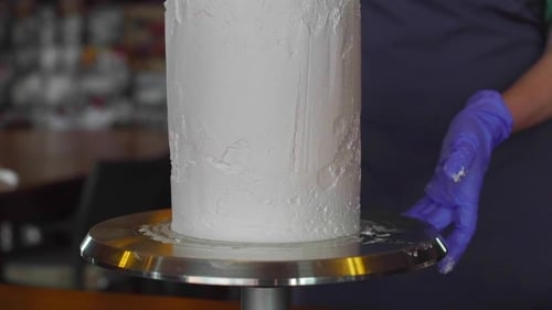Confectioner Decorates Cake