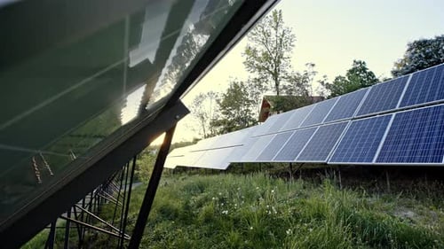 Two Engineers Are Conducting Outdoor Inspection of Solar Photovoltaic Panels