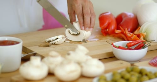 Slicing Mushrooms and Fresh Ingredients for Cooking