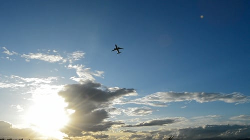 Airplane Taking Off at Sunset