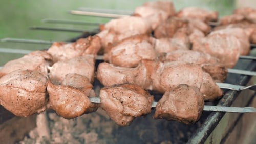 Barbecue Skewers With Meat Cooking On The Grill