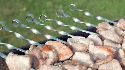 Barbecue Skewers With Meat Cooking On The Grill