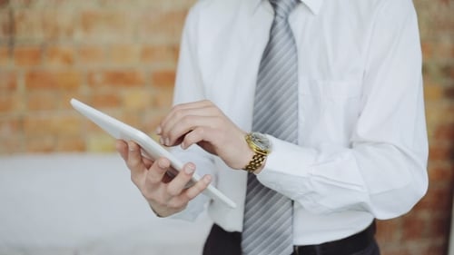 Businessman Person Tapping Screen Of Tablet Computer