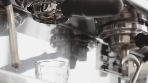 Espresso Machine Extracts Coffee into Small Glass