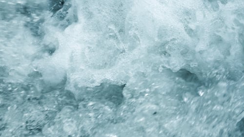 Close Up of Flowing Water with Bubbles