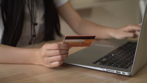 Young Adult Shopping Online with Credit Card