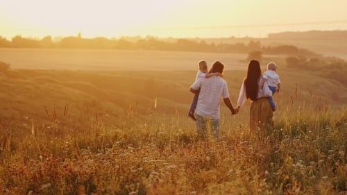Happy Family At Sunset