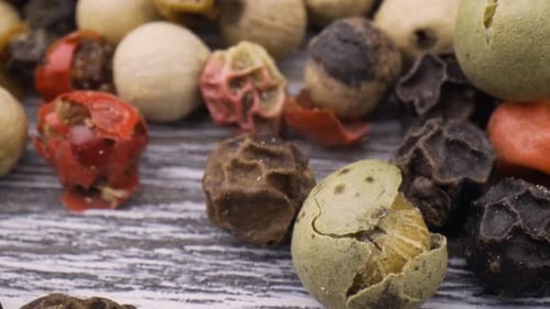 Colorful Peppercorns on a Wooden Surface Close Up