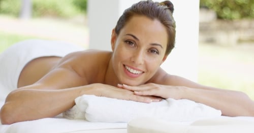 Woman relaxing on a massage table outdoors