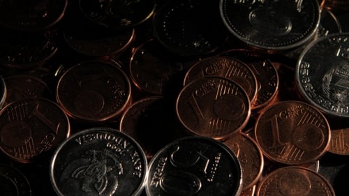 Detailed Close-Up of Glistening Coins