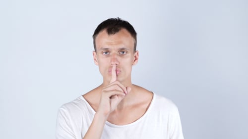 Young Adult Asking For Silence Gesture