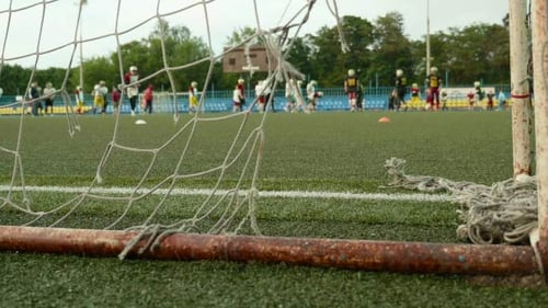 Youth Soccer Teams Practice on Outdoor Field