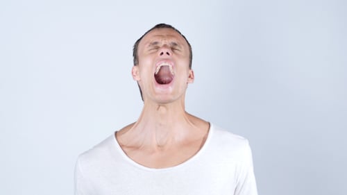 Young Adult Shouting Loudly in Frustration